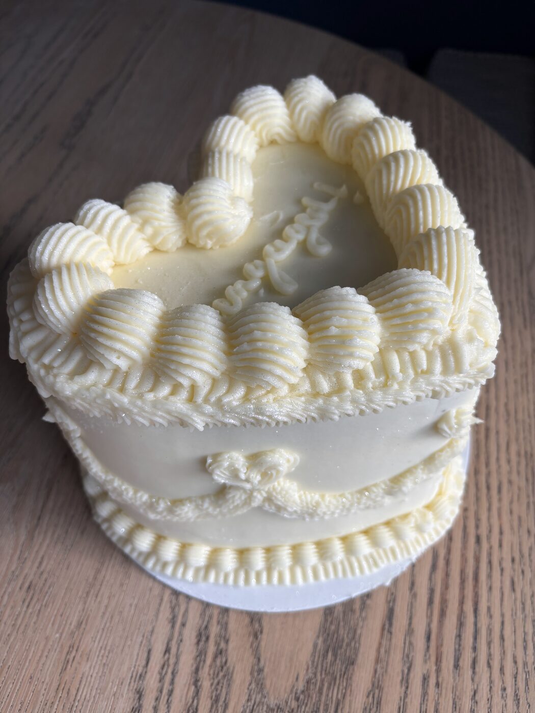 Ivory heart shaped sculpted cake